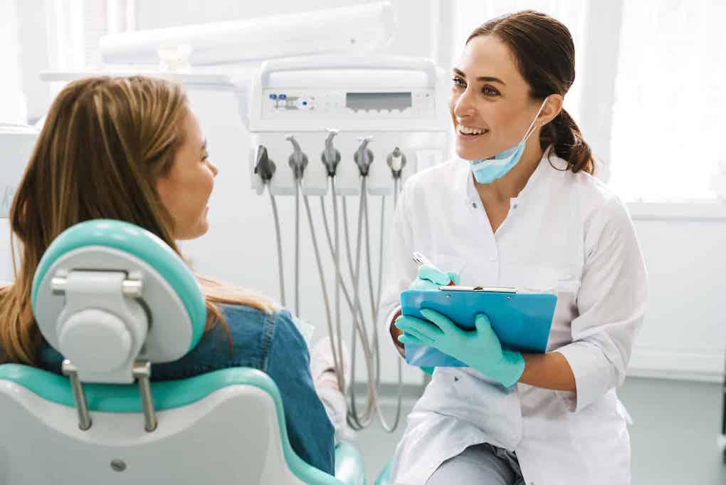 woman patient seeing female dentist about how to maintain oral health