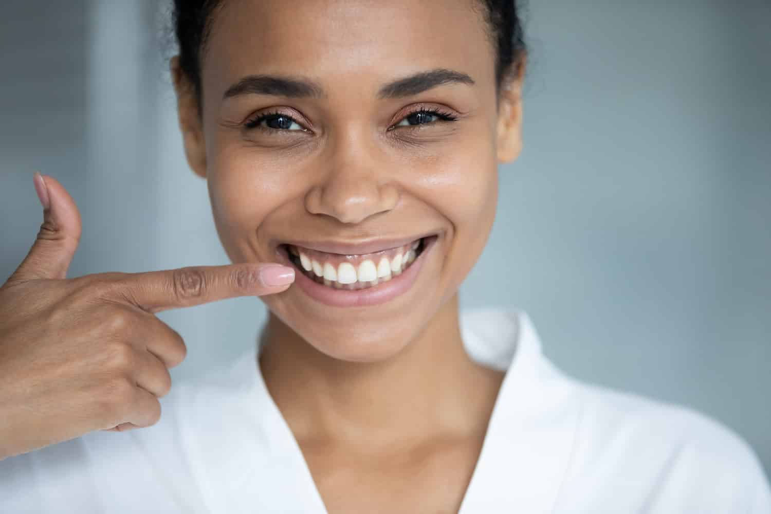 woman in white smiling