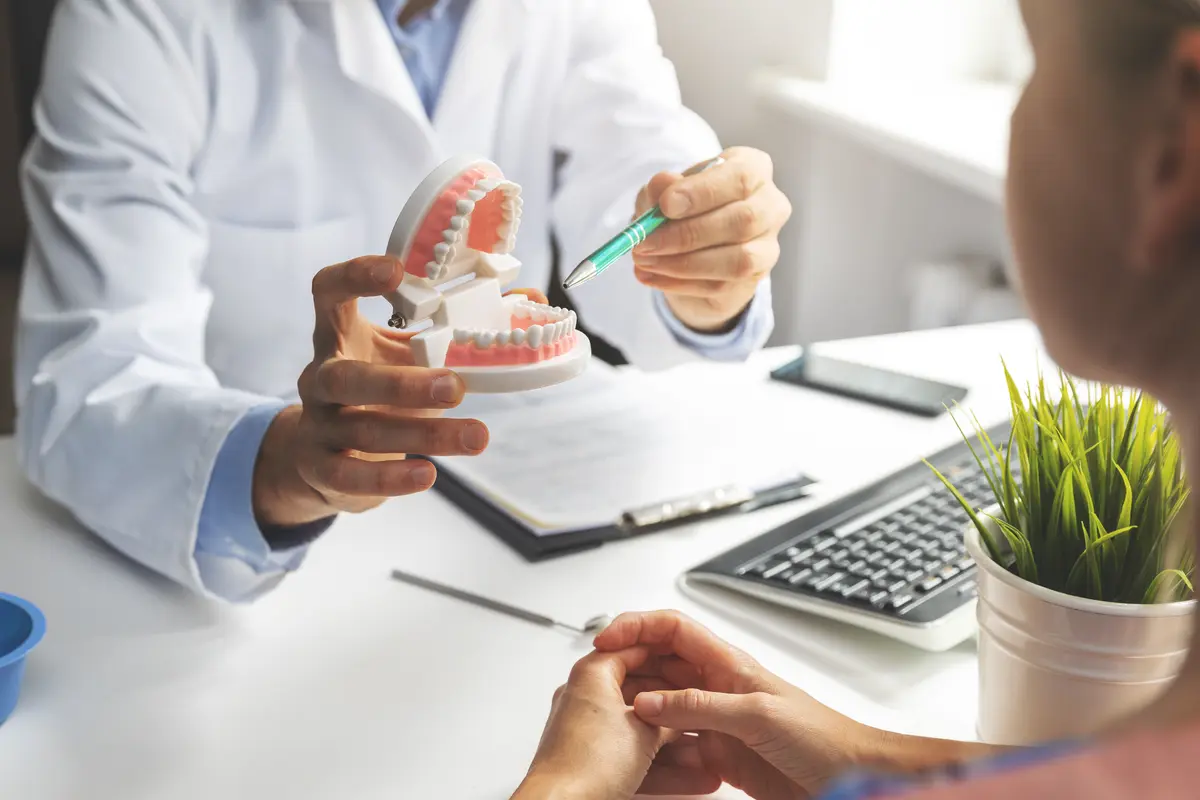 doctor with tooth model